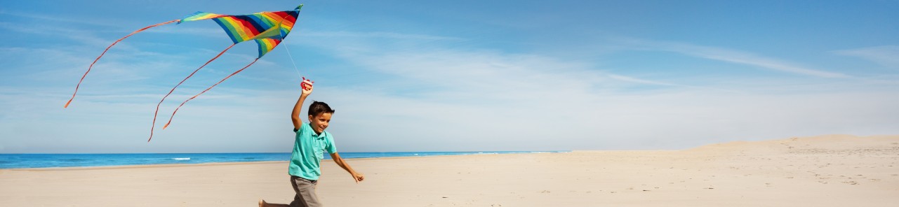 child flying kite